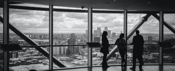 people standing inside city building